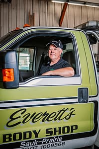 Bryan inside Everett's Body Shop & Towing tow truck